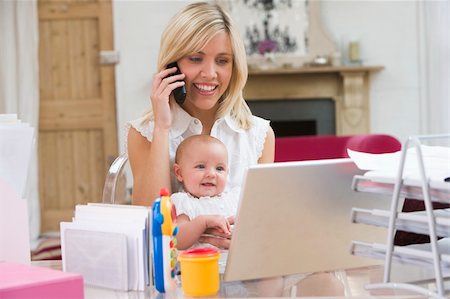 Mother and baby in home office with laptop and telephone Stock Photo - Budget Royalty-Free & Subscription, Code: 400-04045840