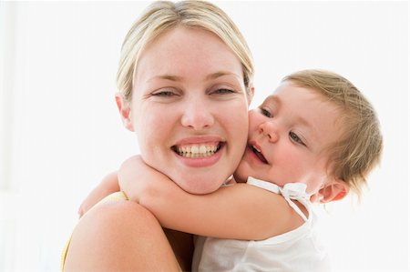 simsearch:400-04045907,k - Mother and baby indoors hugging and smiling Stock Photo - Budget Royalty-Free & Subscription, Code: 400-04045875