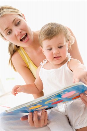 simsearch:400-04045907,k - Mother and baby reading book indoors and pointing Stock Photo - Budget Royalty-Free & Subscription, Code: 400-04045873
