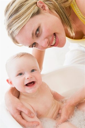Mother giving baby bubble bath smiling Stock Photo - Budget Royalty-Free & Subscription, Code: 400-04045881