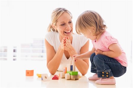 simsearch:400-04045907,k - Mother and daughter indoors playing and smiling Stock Photo - Budget Royalty-Free & Subscription, Code: 400-04045894