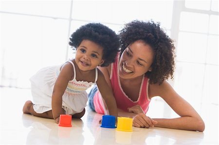 Mother and daughter indoors playing and smiling Stock Photo - Budget Royalty-Free & Subscription, Code: 400-04045906