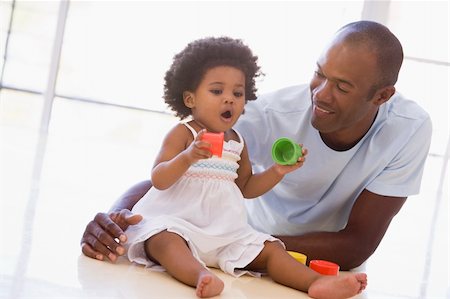 simsearch:400-04045907,k - Father and daughter indoors playing and smiling Stock Photo - Budget Royalty-Free & Subscription, Code: 400-04045908