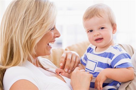 simsearch:400-04045907,k - Mother in living room holding baby smiling Stock Photo - Budget Royalty-Free & Subscription, Code: 400-04045901