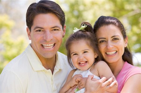 simsearch:400-08891803,k - Family standing outdoors smiling Stock Photo - Budget Royalty-Free & Subscription, Code: 400-04045911