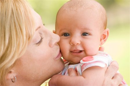 simsearch:400-04045907,k - Mother kissing baby outdoors Stock Photo - Budget Royalty-Free & Subscription, Code: 400-04045924