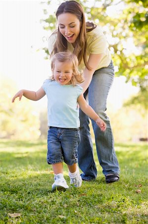 simsearch:400-04045907,k - Mother and daughter playing outdoors smiling Stock Photo - Budget Royalty-Free & Subscription, Code: 400-04045920