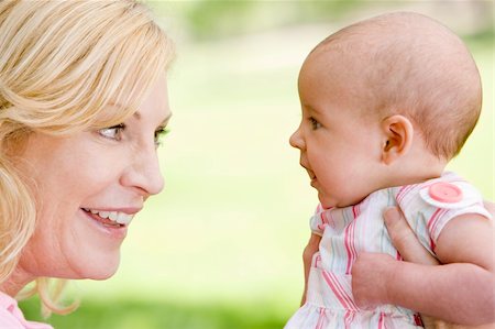 simsearch:400-04043055,k - Mother and baby outdoors smiling Stock Photo - Budget Royalty-Free & Subscription, Code: 400-04045922
