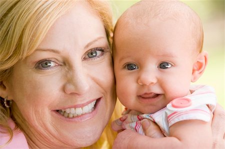 simsearch:400-04043055,k - Mother and baby outdoors smiling Stock Photo - Budget Royalty-Free & Subscription, Code: 400-04045923
