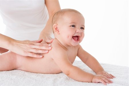 full body massage - Mother massaging baby Stock Photo - Budget Royalty-Free & Subscription, Code: 400-04045941