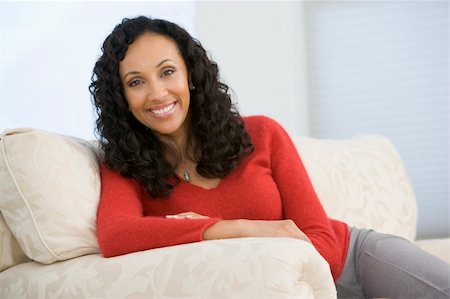 Woman sitting in living room Stock Photo - Budget Royalty-Free & Subscription, Code: 400-04046241