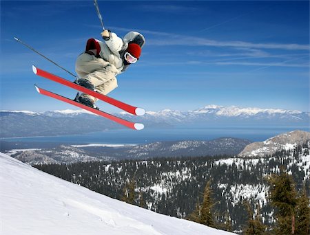 simsearch:400-04811318,k - A young man jumping high at Lake Tahoe resort Stock Photo - Budget Royalty-Free & Subscription, Code: 400-04046740