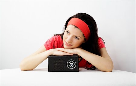 young smiling caucasian woman is listening radio Stock Photo - Budget Royalty-Free & Subscription, Code: 400-04047009