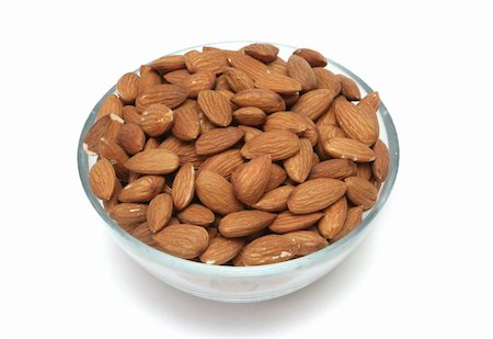 Almonds nuts on a white background Photographie de stock - Aubaine LD & Abonnement, Code: 400-04047083