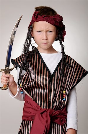 rogues - Boy Pirate isolated on black with a cutlass Stockbilder - Microstock & Abonnement, Bildnummer: 400-04047168