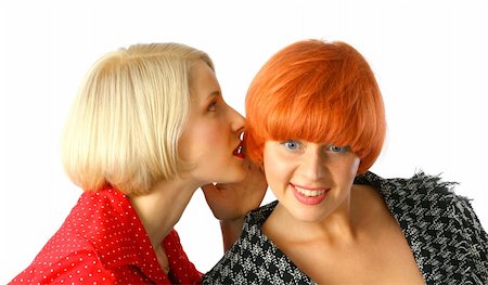 Two happy young women whispering and surprised Foto de stock - Royalty-Free Super Valor e Assinatura, Número: 400-04047414