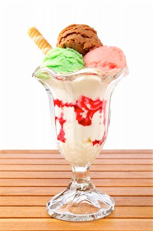 simsearch:400-04039032,k - Delicious multi flavor ice cream glass on wooden background. Shallow depth of field Photographie de stock - Aubaine LD & Abonnement, Code: 400-04047896