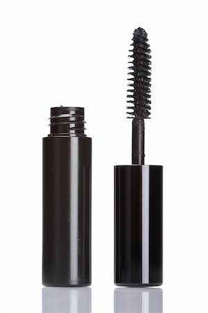 Detail of assortment of makeups reflected on white background. Shallow depth of field Foto de stock - Super Valor sin royalties y Suscripción, Código: 400-04047922