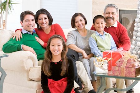 Family Sitting Around A Coffee Table And Christmas Gifts Stock Photo - Budget Royalty-Free & Subscription, Code: 400-04047997