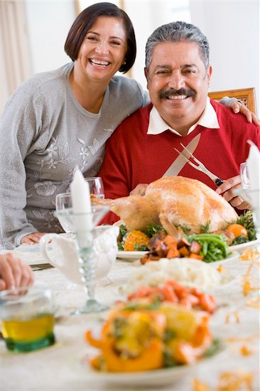 Woman With Her Arm Around Her Husband,Who Is Getting Ready To Ca Stock Photo - Royalty-Free, Artist: MonkeyBusinessImages, Image code: 400-04048007