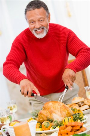 senior man eating table not woman - Man Carving Roast Chicken Stock Photo - Budget Royalty-Free & Subscription, Code: 400-04048073