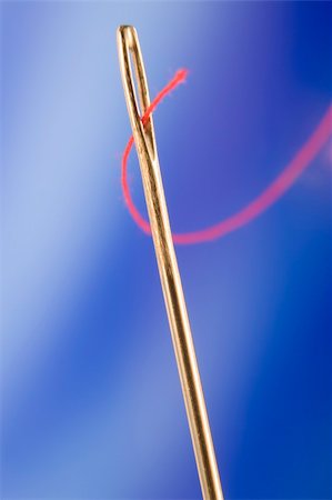 Close Up Of Needle And Red Thread Stock Photo - Budget Royalty-Free & Subscription, Code: 400-04048201