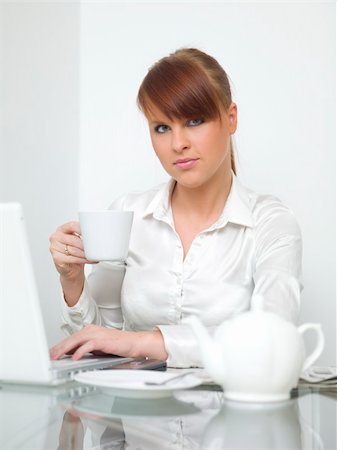 simsearch:400-03996848,k - Business woman is working and drinking cofee Fotografie stock - Microstock e Abbonamento, Codice: 400-04048395