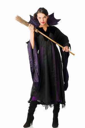 the witch in black dress with a little broom starting to fight Stock Photo - Budget Royalty-Free & Subscription, Code: 400-04048679