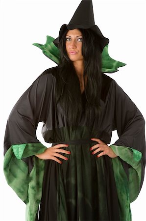beautiful witch in pose with a black and green dress and hat Stock Photo - Budget Royalty-Free & Subscription, Code: 400-04049310