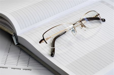 simsearch:400-04592928,k - gold glass and white blank notebook. daylight. Stock Photo - Budget Royalty-Free & Subscription, Code: 400-04049423