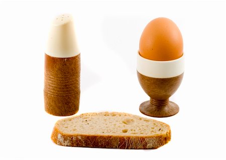a soft boiled egg, a slice of bread and a saltpot Foto de stock - Royalty-Free Super Valor e Assinatura, Número: 400-04049512