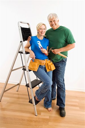 Middle-aged couple with household tools next to ladder. Stock Photo - Budget Royalty-Free & Subscription, Code: 400-04040019