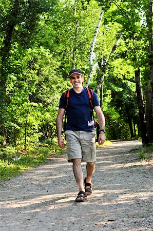 simsearch:862-03289011,k - Happy middle aged man walking on a forest trail Foto de stock - Super Valor sin royalties y Suscripción, Código: 400-04040025