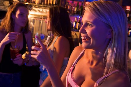 simsearch:400-04040205,k - Three young women drinking at a nightclub Stock Photo - Budget Royalty-Free & Subscription, Code: 400-04040205