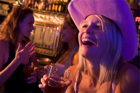 simsearch:400-04040205,k - Young woman in cowboy hat laughing at a nightclub Stock Photo - Budget Royalty-Free & Subscription, Code: 400-04040207