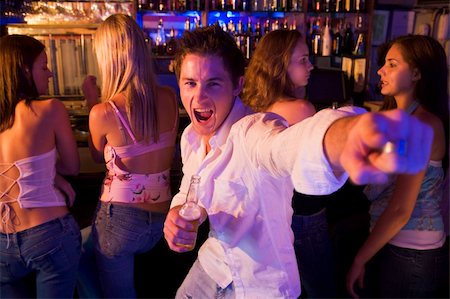 simsearch:400-06396842,k - Young man in nightclub showing off for the camera Stock Photo - Budget Royalty-Free & Subscription, Code: 400-04040216