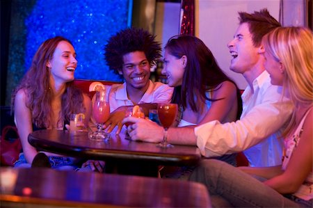simsearch:400-04040298,k - Group of young adults in a nightclub talking and laughing Stockbilder - Microstock & Abonnement, Bildnummer: 400-04040249