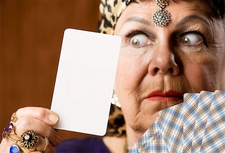 Gypsy fortune teller hiolding a blank tarot card Photographie de stock - Aubaine LD & Abonnement, Code: 400-04040342