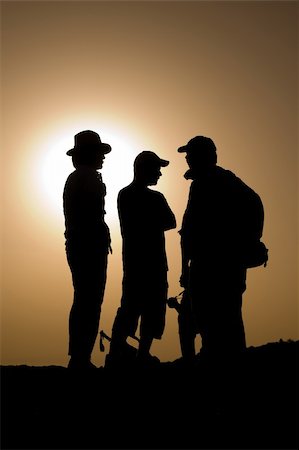 simsearch:400-04557469,k - three explorer silhouettes on the top of a mountain Stock Photo - Budget Royalty-Free & Subscription, Code: 400-04040382