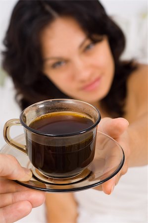 simsearch:693-08127560,k - A man giving a young woman a cup of coffee at morning, before getting up - part of a series. Stock Photo - Budget Royalty-Free & Subscription, Code: 400-04040655