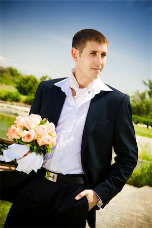 simsearch:400-04171391,k - well-dressed groom with rose bouquet Stock Photo - Budget Royalty-Free & Subscription, Code: 400-04040706