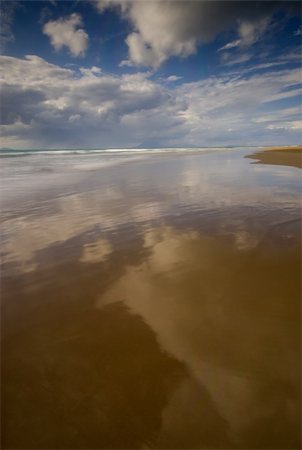 Cloud reflection on the wet sand after the tide Stock Photo - Budget Royalty-Free & Subscription, Code: 400-04041461