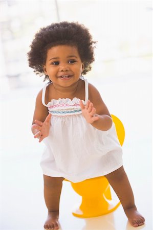 potty training girl - Baby indoors going on potty smiling Stock Photo - Budget Royalty-Free & Subscription, Code: 400-04041782