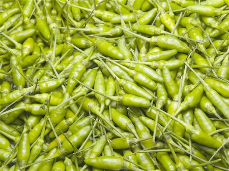 simsearch:400-07899696,k - A handful of organic Green Bird's Eye Chili Peppers for background. Photographie de stock - Aubaine LD & Abonnement, Code: 400-04041837