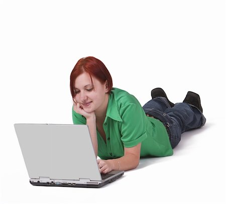 simsearch:400-05734794,k - Redheaded teenager lying down in front of a laptop. Foto de stock - Super Valor sin royalties y Suscripción, Código: 400-04042172