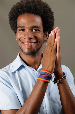 simsearch:400-06065810,k - Portrait of young positive african male model with pleased expression Foto de stock - Super Valor sin royalties y Suscripción, Código: 400-04042287