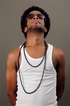 simsearch:400-04539832,k - Portrait of young trendy african man posing Foto de stock - Royalty-Free Super Valor e Assinatura, Número: 400-04042291