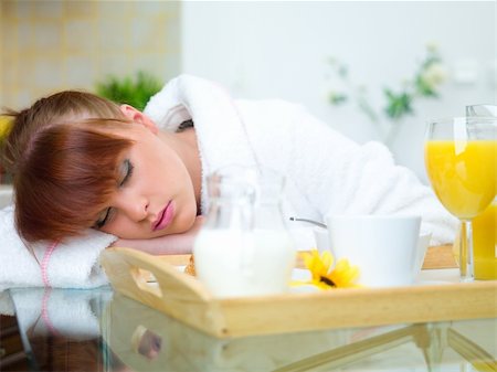 Beautiful woman in kitchen sleeping on table Stock Photo - Budget Royalty-Free & Subscription, Code: 400-04042371