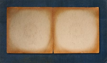 simsearch:400-05174298,k - Worn Tattered Vintage Parchment Paper on Blue Linen Background Stockbilder - Microstock & Abonnement, Bildnummer: 400-04042488