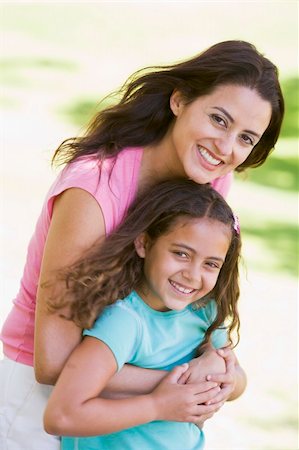 simsearch:400-04046012,k - Woman and young girl outdoors embracing and smiling Stockbilder - Microstock & Abonnement, Bildnummer: 400-04042802